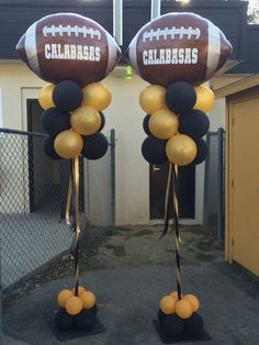 two football balloons are on top of each other