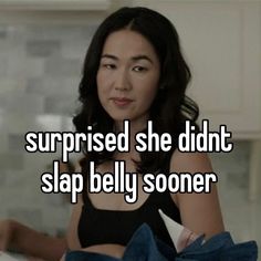 a woman in a black top with the words surprised she didn't slap belly soon