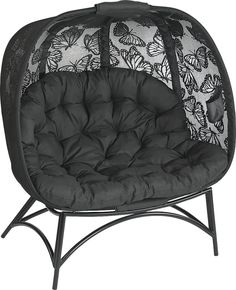 a black and white chair with butterfly print on it's back cover, sitting in front of a white background