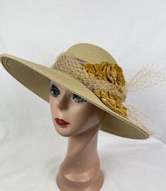 This one of a kind Tan 4 inch brim Toyo Straw hat is trimmed with 3 handmade gold velvet flowers, feathers, organza ribbon band with bow and removable gold netting. The hat will fit 22- 22 5/8 inch head sizes with a sizing cord inside the band to adjust to your head size. NOTE: Please check the head size before purchase, I am happy to answer any questions you may have. There will be a 20% restocking fee for all returned hats. Gold Straw Hat With Flat Brim, Handmade Gold Hat For Kentucky Derby, Handmade Gold Summer Hats, Handmade Gold Wide Brim Hat, Gold Flat Brim Hat Bands For Kentucky Derby, Gold Wide Brim Straw Hat, Gold Flat Brim Sun Hat For Kentucky Derby, Gold Brimmed Straw Hat, Elegant Gold Hat Band For Beach