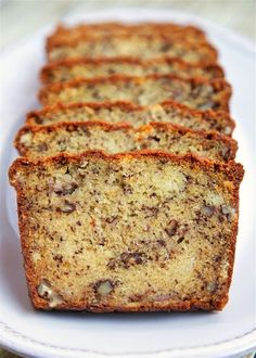 slices of banana nut bread on a white plate with the words, the very best banana nut bread