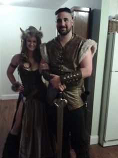 a man and woman dressed up in costumes