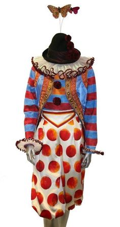 a mannequin dressed as a clown with a butterfly on his head and dress