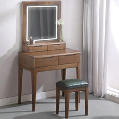 a wooden vanity with a mirror and stool