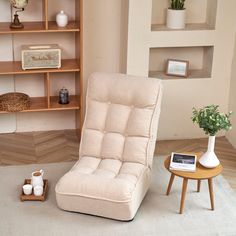 a chair and table in a room with shelves