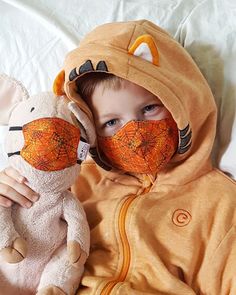 Child size + Toy size face mask set.  You will receive 1 child size and 1 toy size mask in matching fabrics. 2 layers of 100% cotton, mama made in the USA.  No nose wire needed as the unique shape stays up and stays put on little ones, even while playing. This size fits children ages 3-9 best.  Soft and stretchy elastic won't chafe behind little ears. I designed this set when my 7 year old refused to wear a mask. He complained all about it and told me that the only way he'd wear one was if his favorite stuffed animal got to wear one too. So I made a matching toy mask. And instantly, magically, mask wearing was fun. Instead of something weird and slightly scary, he started thinking of it as playtime. His stuffie did come with us every time we had to leave the house, but he wasn't complainin Baby Face Mask, Mask With Mouth Zipper, Kids Eye Mask, Elephant Face Mask, Vintage Children’s Skeleton Mask, Animal Face Mask, Face Masks For Kids, Face Mask Set, Happy Mama