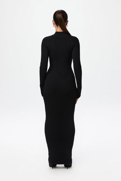 Our soft-to-the-touch ribbed-knit sweater maxi dress is designed with a turtleneck, long fitted sleeves, and a playful ribbed design and v-waist to accentuate your shape. Pair with your favorite flats, boots or heels. Knits Collection Import 52% Viscose, 27% Polyester, 21% Nylon Model wears size XS True to size Ribbed Stretch Maxi Dress, Stretch Ribbed Maxi Dress, Sleek Ribbed Dress For Fall, Sleek Ribbed Fall Dress, Ribbed Maxi Dress For Work, Chic Long Ribbed Sweater Dress, Fitted Ribbed Maxi Dress, Ribbed Fitted Maxi Sweater Dress, Fitted Ribbed Maxi Sweater Dress