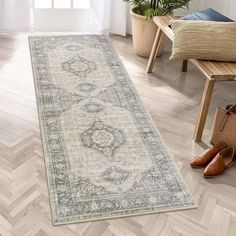 a large rug with an ornate design on the floor