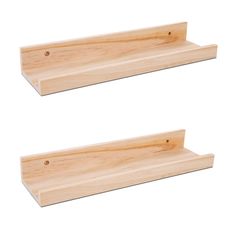 two wooden shelfs sitting next to each other