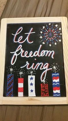 a sign that says, let freedom ring with fireworks in the sky and stars on it