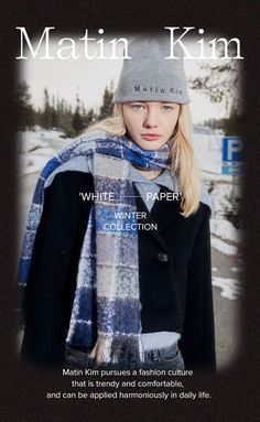 a woman wearing a hat, scarf and coat in the snow with text that reads white paper winter collection