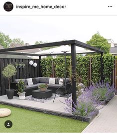 an outdoor living area with furniture and plants