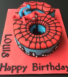 a birthday cake with spiderman on it