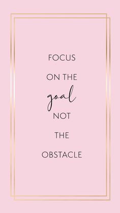 the words focus on the goal not the obstacle are in gold frame against a pink background