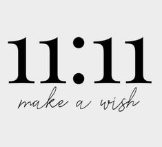 the words 11 11 make a wish written in black ink