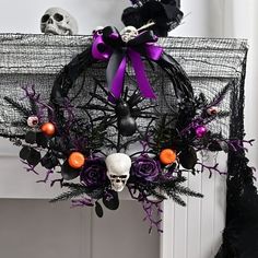 a wreath decorated with halloween decorations and skulls