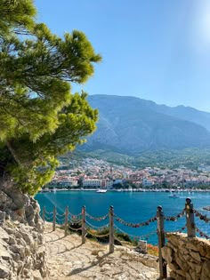 a scenic view of the sea, mountains and city from an overlook point in croatia