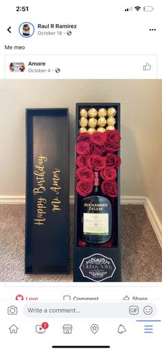 an open box with roses and chocolates in it next to a bottle of liquor