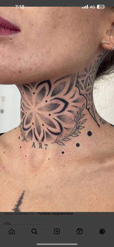 a woman's neck with a tattoo on it