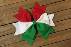 Beautiful Christmas hair bow in red, white, and green . The perfect Christmas hair bow. A cute combination of Cherry red, snow white, and kelly green grosgrain ribbons that have been heat sealed to ensure durability. Bow is securely attached to a no-slip alligator clip and measures Approx. 5 inches across x 4 inches tall Back to Store home: https://www.etsy.com/shop/PinkHairBowBoutique?ref=l2-shop-info-name