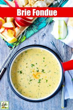 a bowl of broccoli and apple soup on a wooden table with the words brie fondue above it