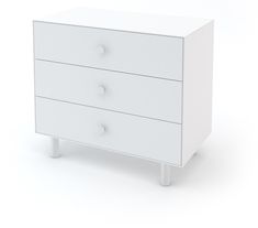 a white dresser with three drawers on one side and two knobs on the other