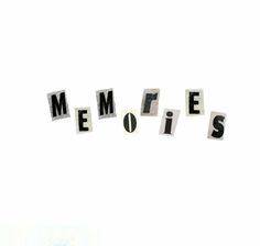 the word memories written in cut out letters