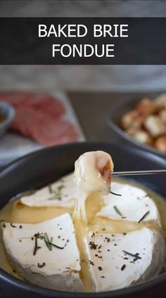 baked brie fondue is being drizzled with butter and served in a bowl