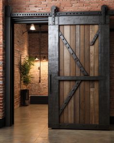 an open wooden door in a brick building