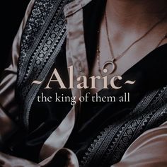 a woman wearing a black shirt and silver necklace with the words,'algic the king of them all '