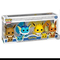 three pokemon pop vinyl figures are in a box on a white background the figure has an eeve and pikachu design