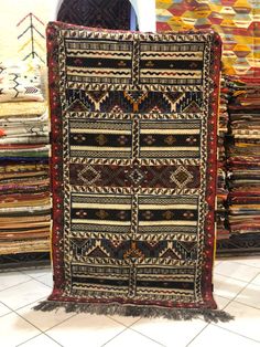 an old rug is on display in a store