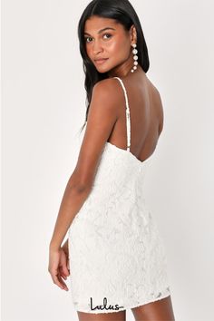 You'll be the star of the night in the Lulus Moonlight Moments White Floral Jacquard Backless Mini Dress! Sturdy woven jacquard, with an embossed floral pattern throughout, shapes a V-neckline, adjustable spaghetti straps, and a darted bodice. The figure-flaunting silhouette continues to a mini hem while the open back design creates an extra-sexy finish! Hidden back zipper/clasp. Fit: This garment fits true to size. Length: Mid-thigh. Size medium measures 26" from top to bottom. Bust: Great for White Hoco Dress, Semi Dresses, Reception Outfit, Lulu Fashion, Adhesive Bra, Backless Mini Dress, Grad Dresses, Floral Jacquard, Little White Dresses