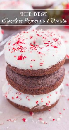 chocolate peppermint donuts stacked on top of each other with white frosting and sprinkles