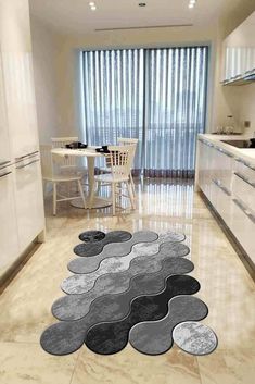 the rugs in the kitchen are designed to look like wavy waves and circles on the floor