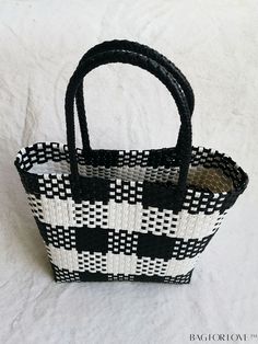 BagForLove - Versatile Plaid Square Tote Bag: Perfect for Casual Outings, Beach Vacations, and Shopping Product Description Color Black Type Straw Bag Strap Type Double Handle Pattern Type Plaid Features High-capacity Closure Type No-closure Composition 100% Polyvinyl Chloride Material PE Size Chart INCH CM Handle Height 7.1 inch Handle Height 18 cm Details Pictures Similar Products h2 { text-align: center; } /* æ¢è¡ */ li{ white-space: normal; word-break: break-all; word-wrap: break-word; } .red-box { width: 100%; display: flex; flex-direction: row; flex-wrap: wrap; justify-content: center; } .red-box > div { width: 190px; height: 250px; margin: 10px; } .red-box > div > a > img { width: 190px; height: 250px; } .size-box { width: 100%; margin: auto; white-space: nowrap; } .table { border Black Woven Handheld Shoulder Bag, Large Capacity Black Beach Bag For Summer, Handmade Black Beach Bag For Travel, Black Summer Straw Bag For Shopping, Handmade Black Bag For Vacation, Eco-friendly Black Bags With Braided Handles, Handmade Black Bags For Vacation, Black Woven Summer Bag, White Square Beach Bag With Large Capacity