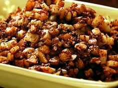 a bowl filled with lots of food sitting on top of a table