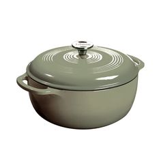 a round casserole with a lid and handles on the side, sitting in front of a white background