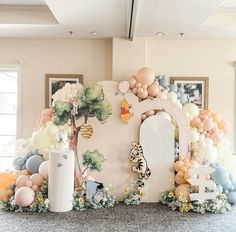 a room with balloons and decorations on the wall