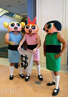 three people in costume standing next to each other