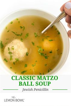 a hand holding a spoon over a bowl of soup with dumplings in it and the title classic matzo ball soup