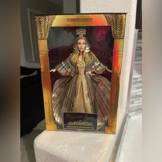 a barbie doll is displayed in a box