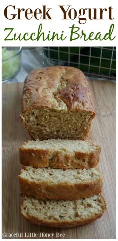 a loaf of greek yogurt zucchini bread on a cutting board