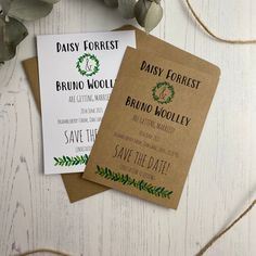 two wedding save the dates cards with greenery