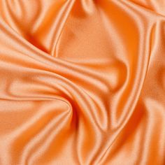 an orange satin fabric with very soft folds