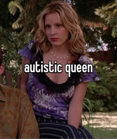 a man and woman sitting next to each other with the words autisttic queen