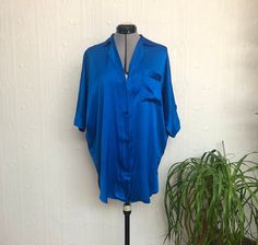 This 80's silk shirt night dress is so cool, it could also be worn as a regular shirt. The sleeves are batwing and the shirt tapers slightly in at the hips. It is meant to be worn oversize. Please look at the following measurements to see how it will fit: Bust across 26 inches (taken under the batwing sleeves), hips 22.5 inches, length 34 inches. Please ask all questions before buying. Thank you. Shirt Night Dress, Blue Silk Shirt, Women's Nightgowns, Nightgowns, Blue Silk, Batwing Sleeve, Silk Shirt, Night Dress, Night Gown