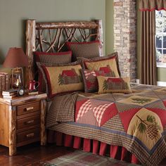 a bed room with a neatly made bed next to a night stand and window sill