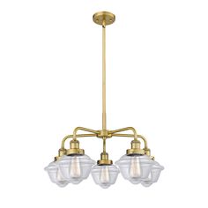 three light brass chandelier with clear glass shades