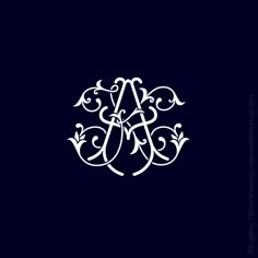 an ornate monogram on a dark blue background